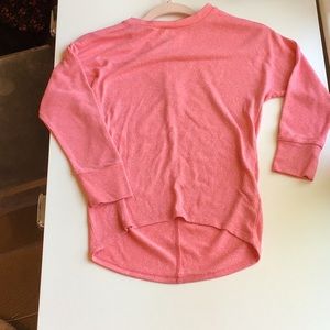 A sweater from old navy that has never been worn.